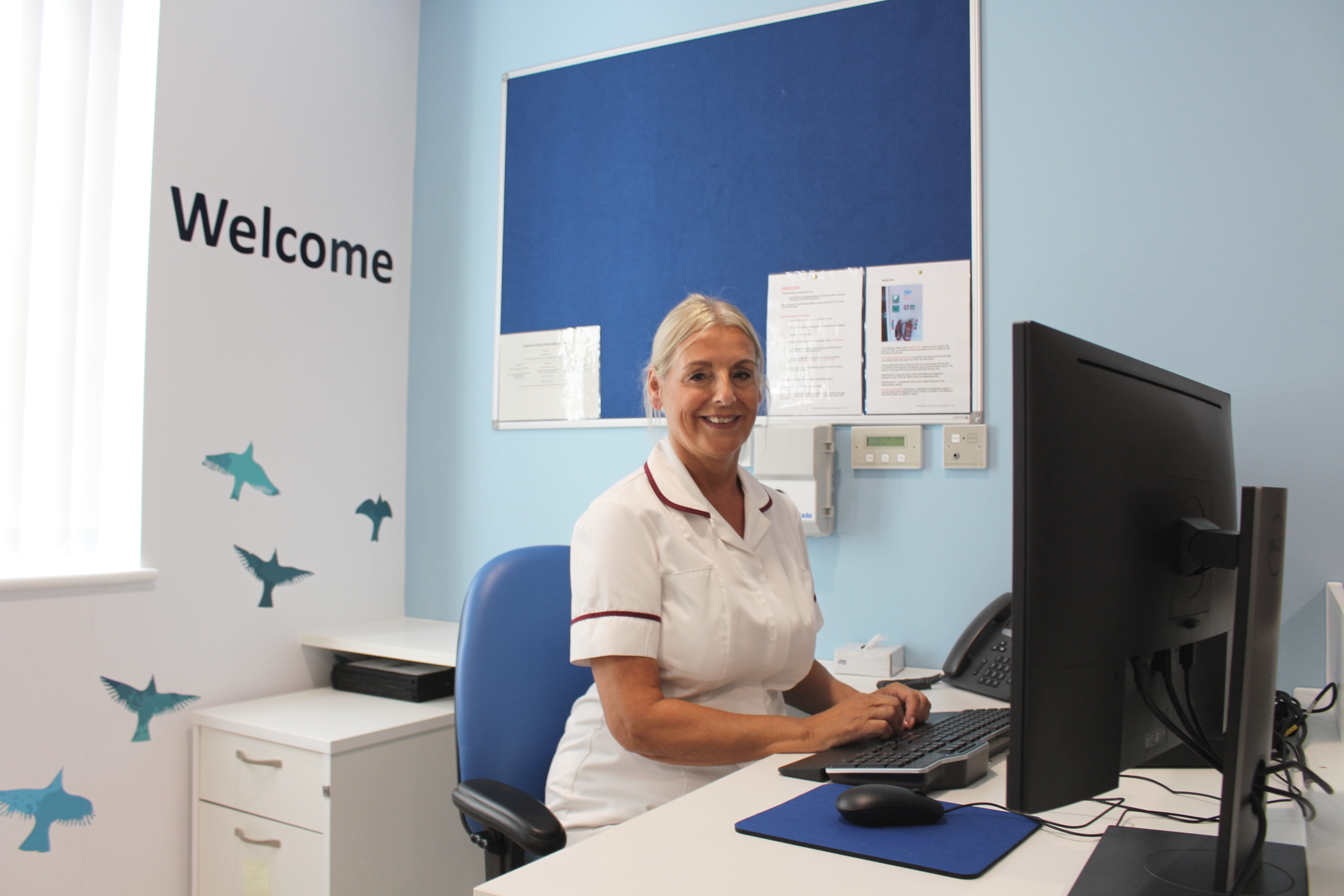 4.	Welcome desk in waiting area, Breast Screening Service at Bath Street with Karen Brady, assistant practitioner