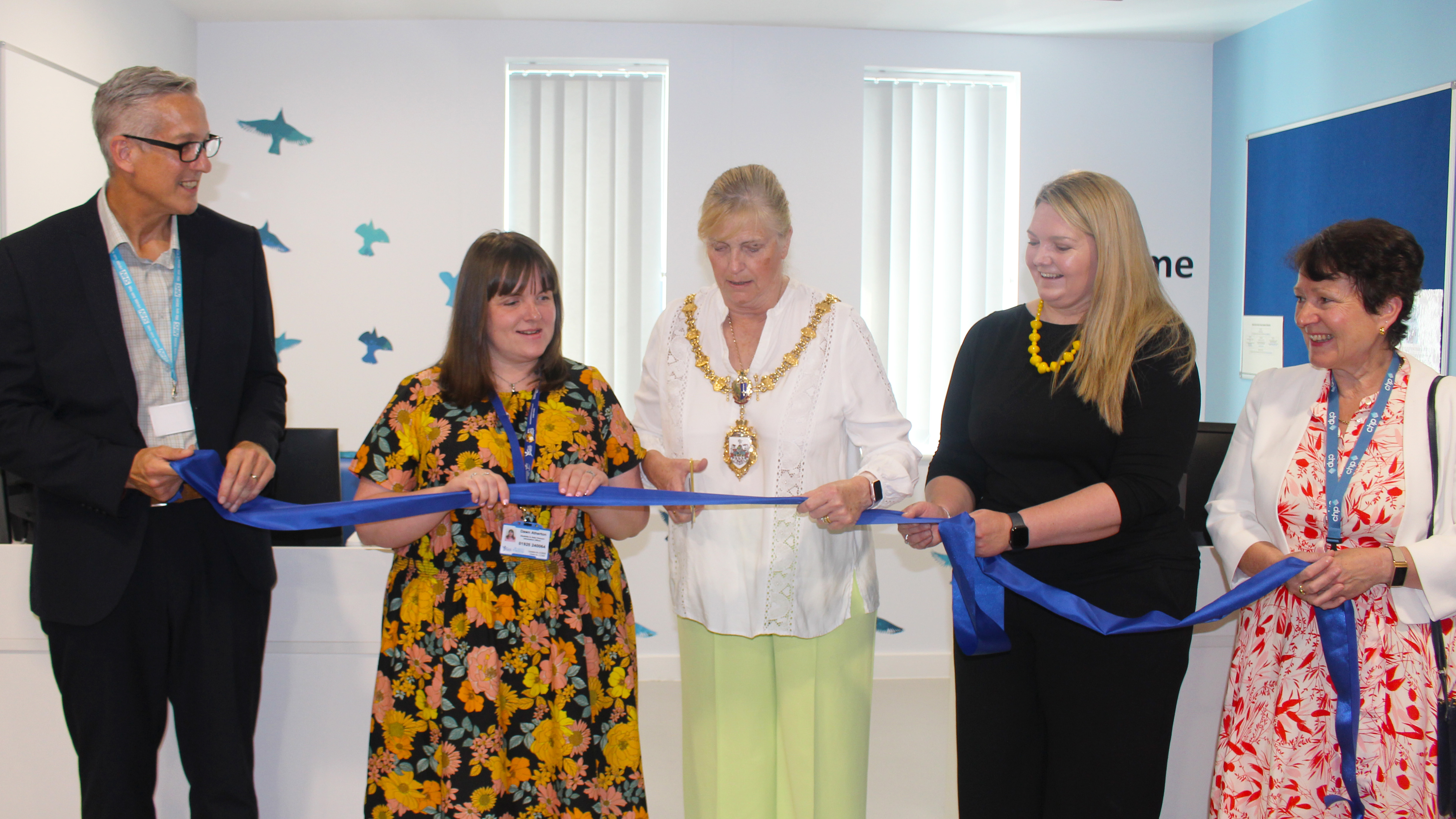 Simon Constable, Dawn Atherton, Mayor of Warrington Cllr Jean Flaherty, Sarah Beaumont-Smith and Wendy Farrington-Chadd at the ribbon cutting in the waiting area of the Breast Screening Clinic at Bath Street