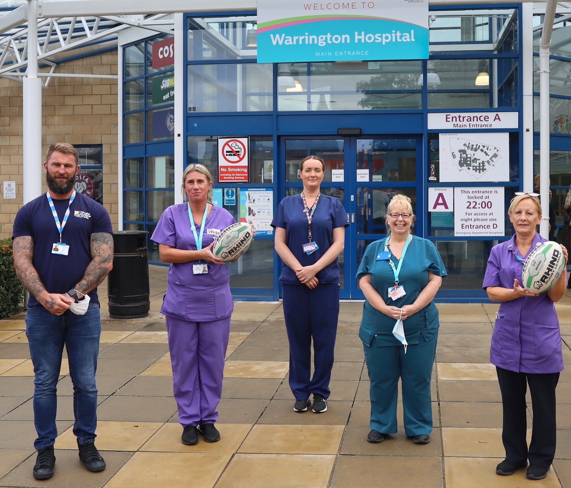 pictured Paul Wood, RL Cares with staff from the Emergency Department at Warrington Hospital.