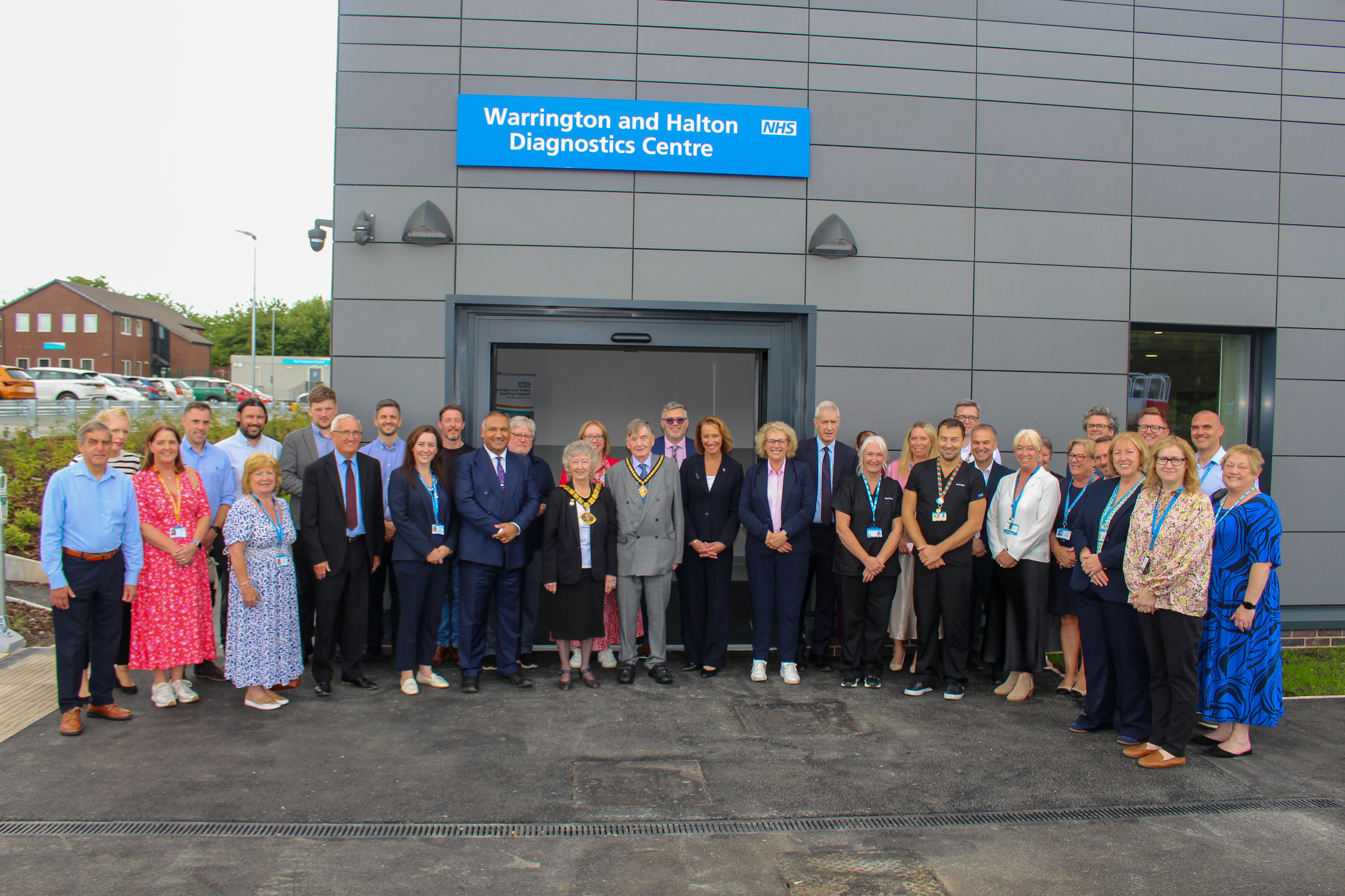 1.	WHH Chief Executive Nikhil Khashu with staff and dignitaries, including local MPs and the Mayor of Halton, at the opening of Warrington and Halton Diagnostics Centre at the Captain Sir Tom Moore Building, Halton Hospital 