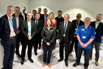 Chief Executive Simon Constable with staff and dignitaries, including MPs Mike Amesbury and Derek Twigg, at the opening of Warrington and Halton Diagnostics Centre at Halton Health Hub.