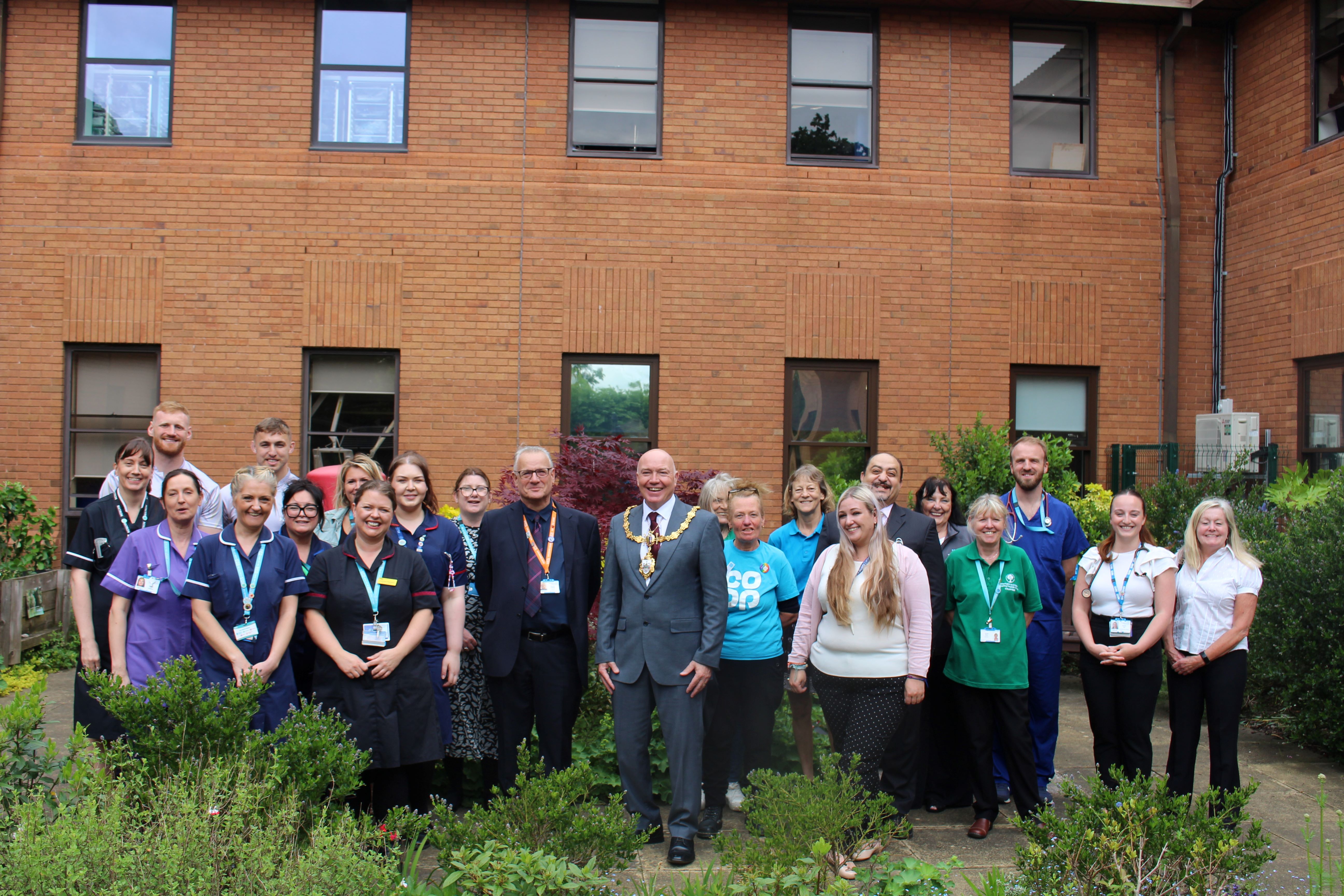 Mayor of Warrington with ward staff, volunteers and supporters at 10-year anniversary celebration event.