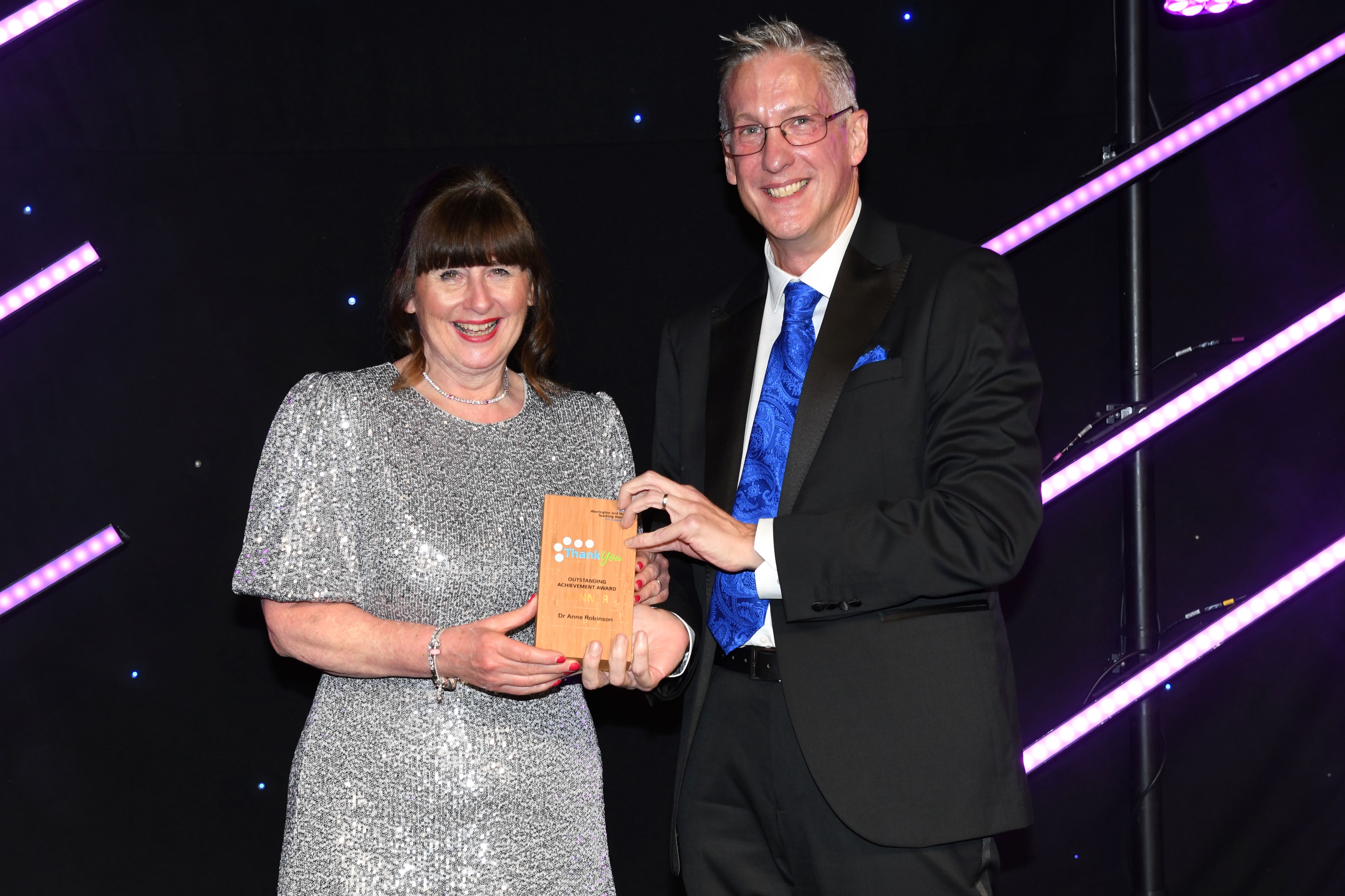 Dr Anne Robinson, Consultant in Emergency Medicine and Deputy Medical Director, was presented with an Outstanding Achievement Award by Simon Constable, Chief Executive of Warrington and Halton Teaching Hospitals NHS Foundation Trust.