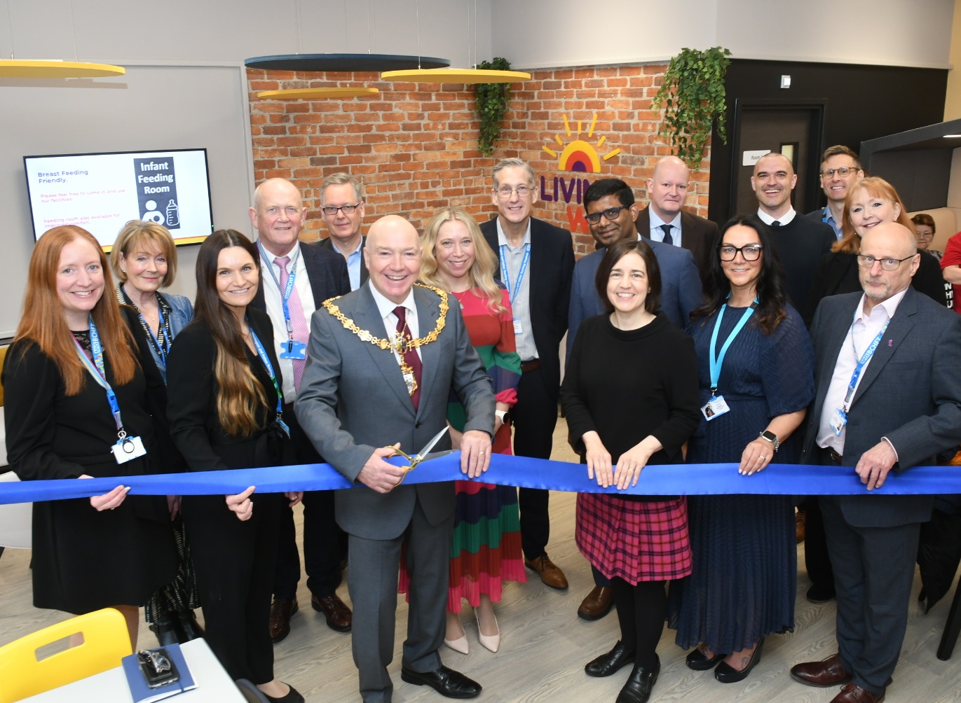 Group photo of ribbon cutting with Mayor Steve Wright.