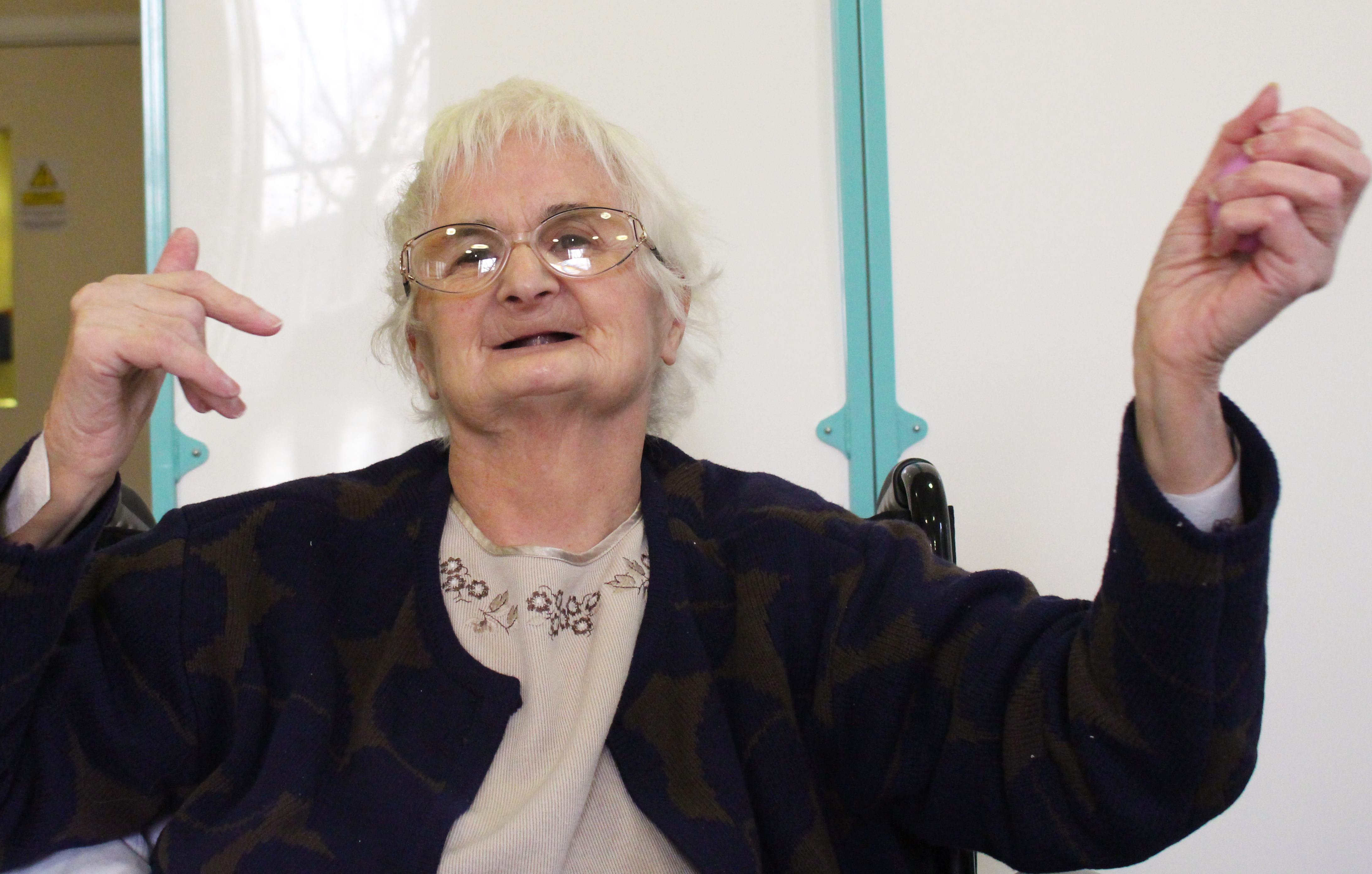 Patient Kathleen Evans finds delight in a sing-along and dance during the weekly music group at Warrington Hospital's Stroke Unit.