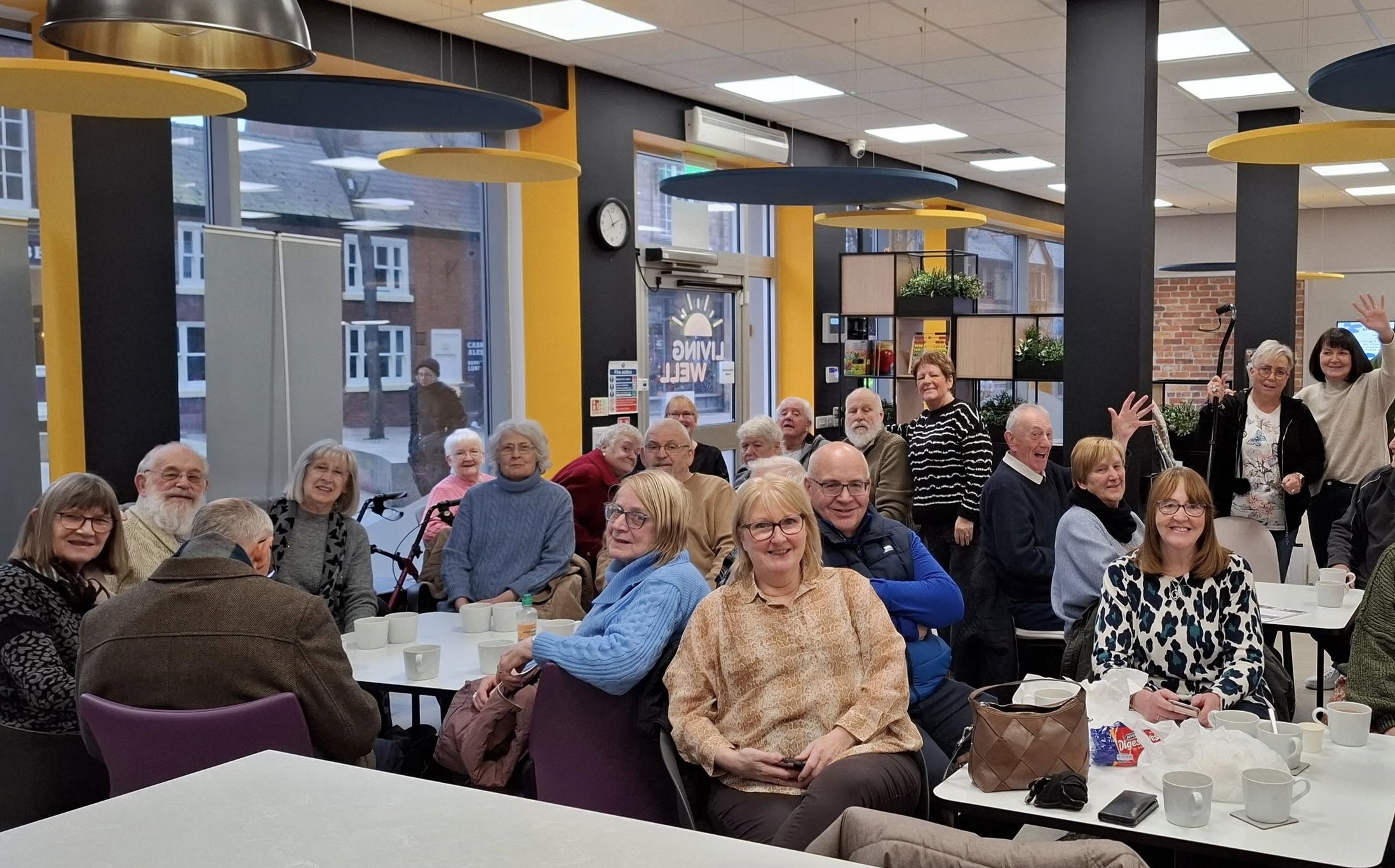 People sat in the Living Well Hub