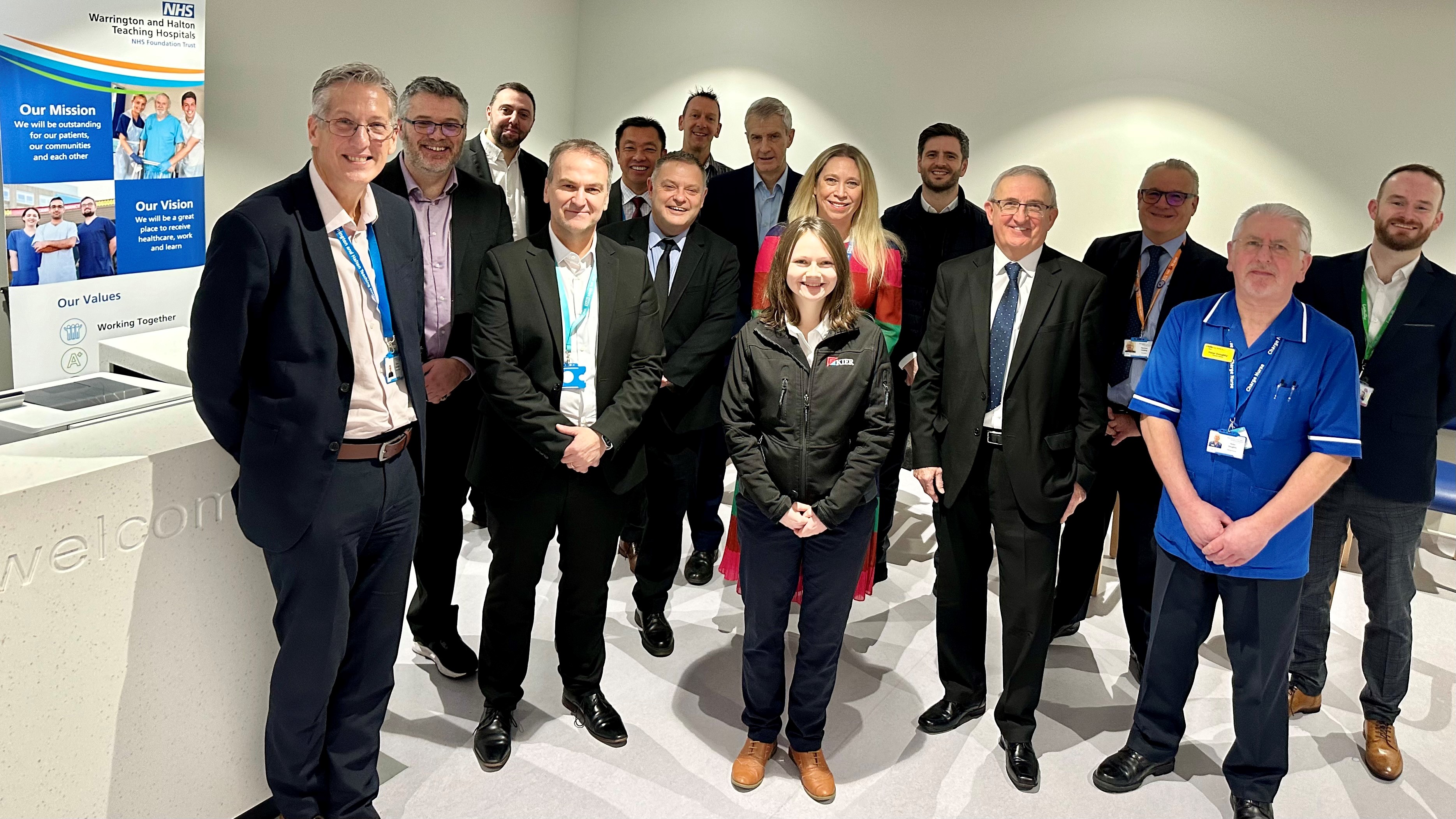 Chief Executive Simon Constable with staff and dignitaries, including MPs Mike Amesbury and Derek Twigg, at the opening of Warrington and Halton Diagnostics Centre at Halton Health Hub.